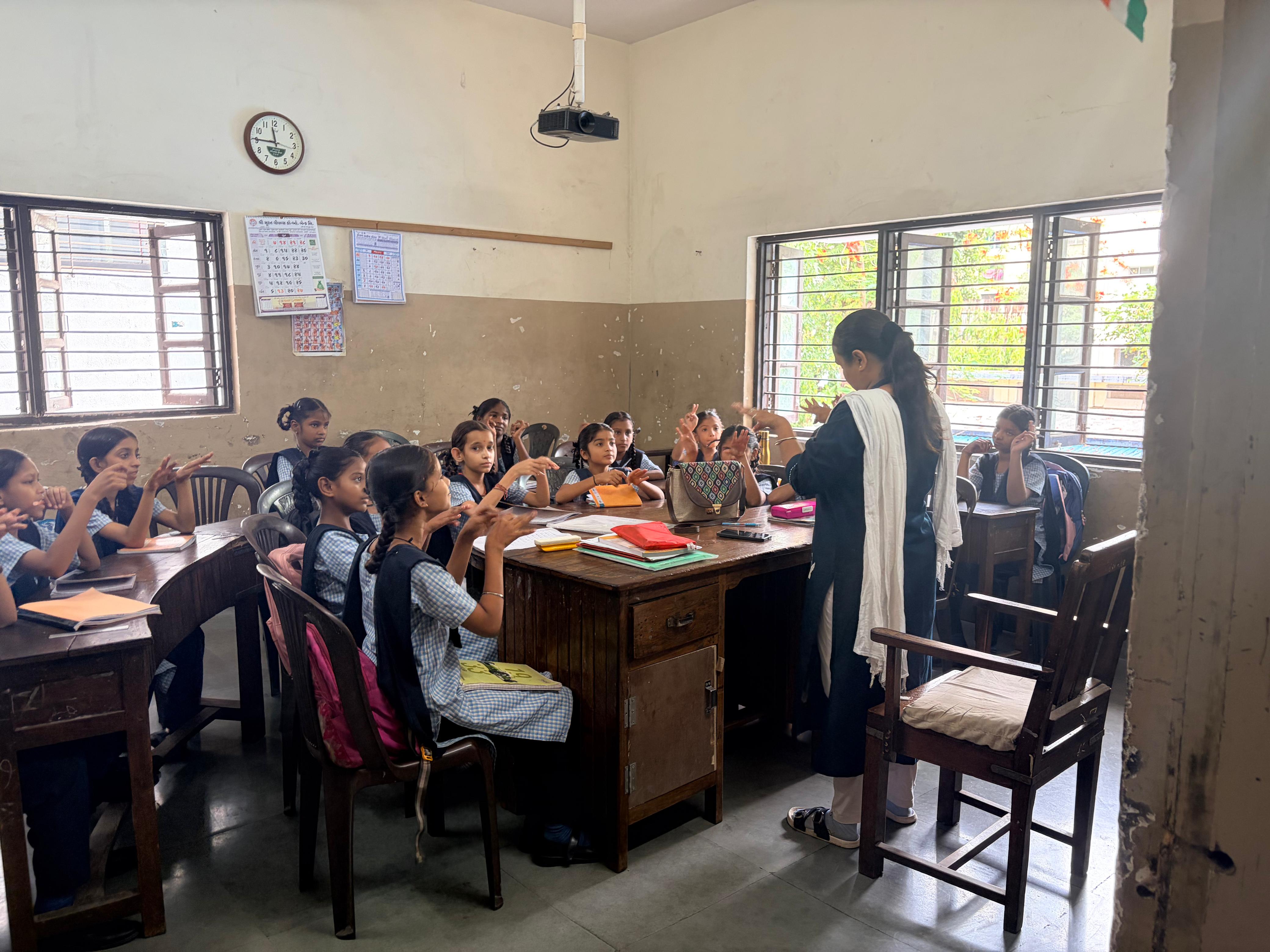 Teacher explaining with Indian Sign Language