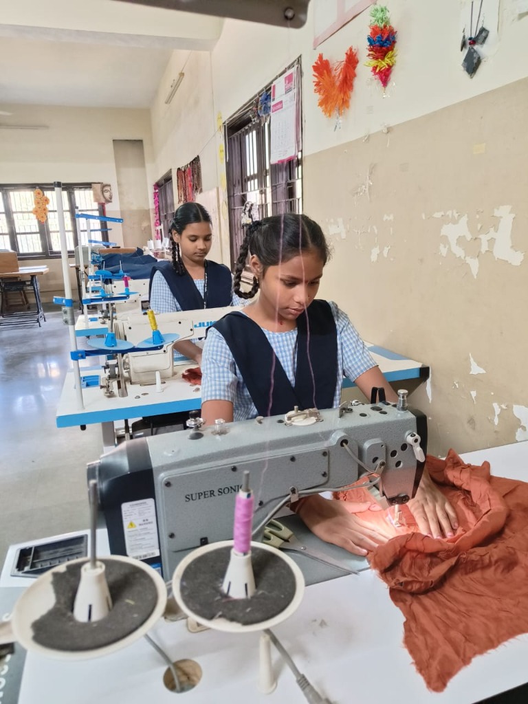 Deaf student stitching garments